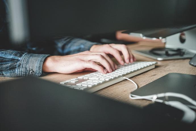 Odoo Customisation person using computer keyboard