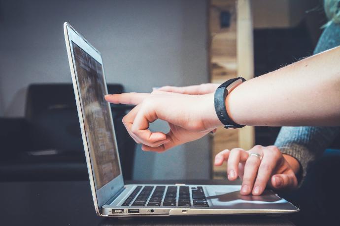Odoo Support person using laptop